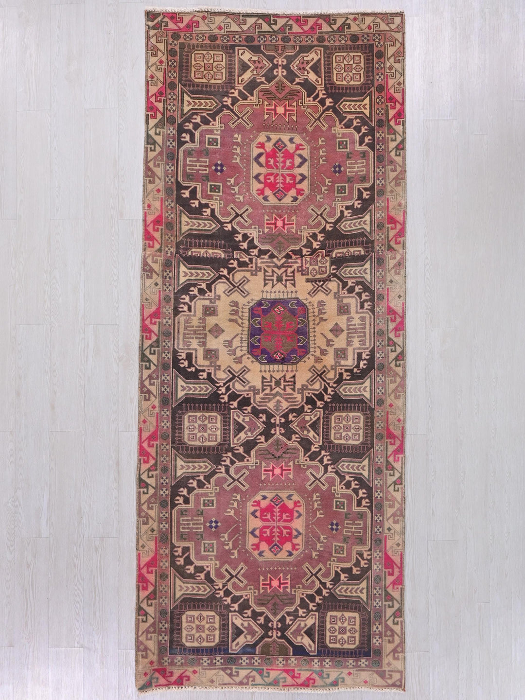 a rug hanging on a wall in a room