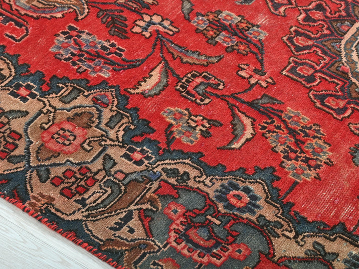 a close up of a rug on a wooden floor