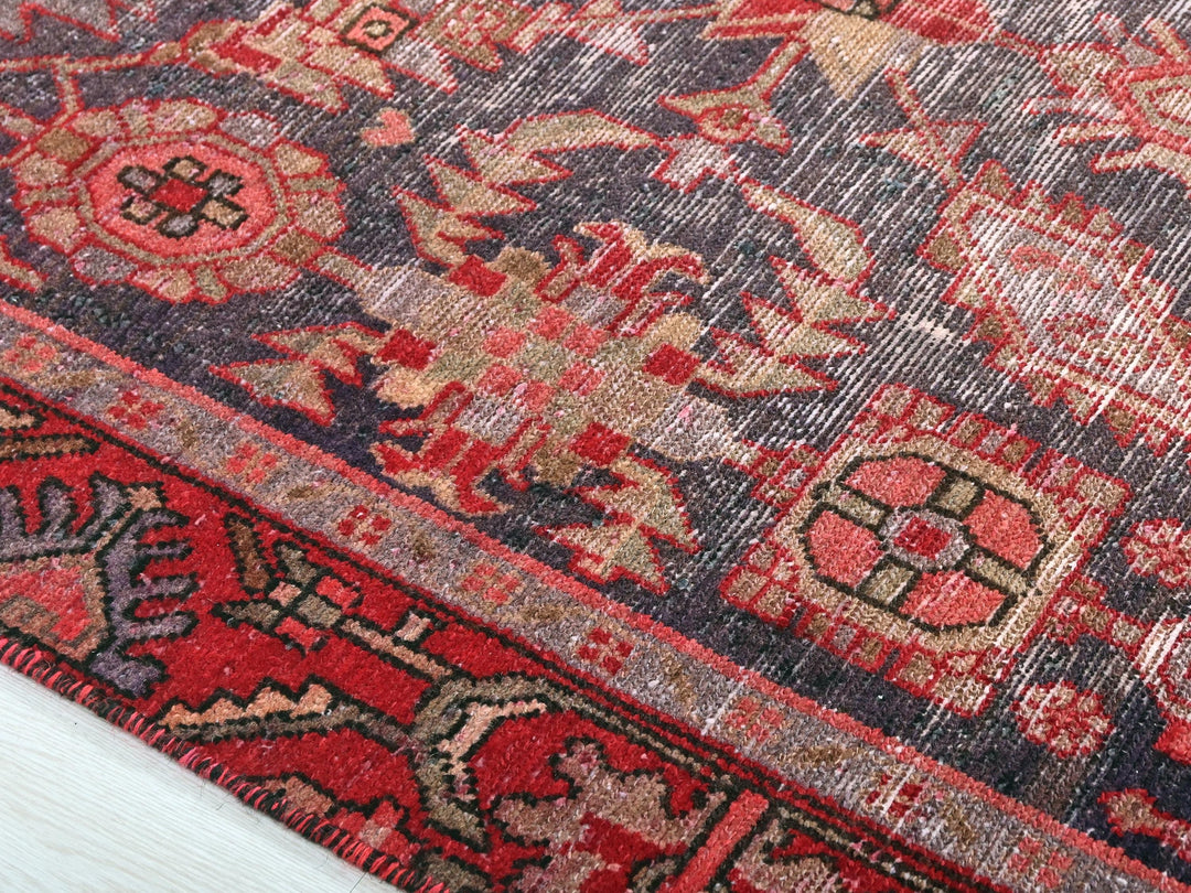 a close up of a rug on a wooden floor