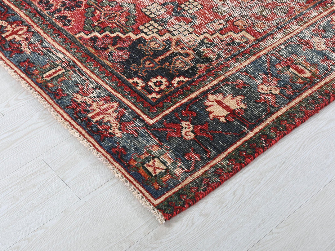 a red and blue rug on a white floor