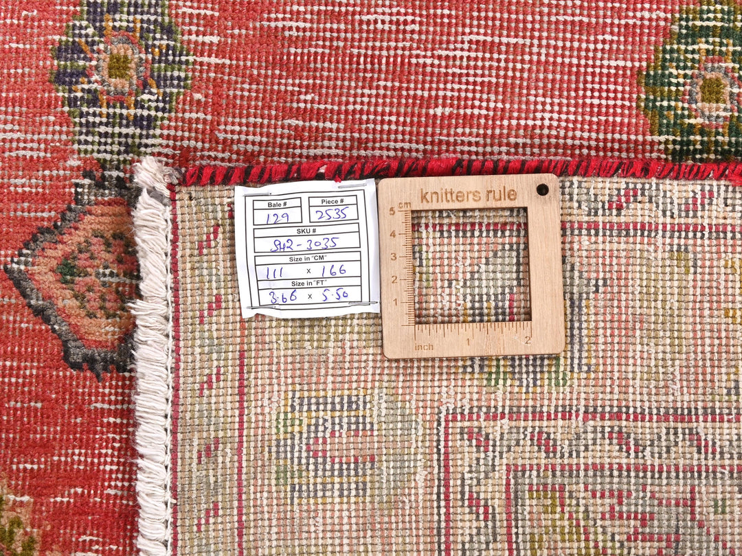 a close up of a rug with a wooden frame