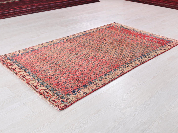 a red rug on a white floor in a room