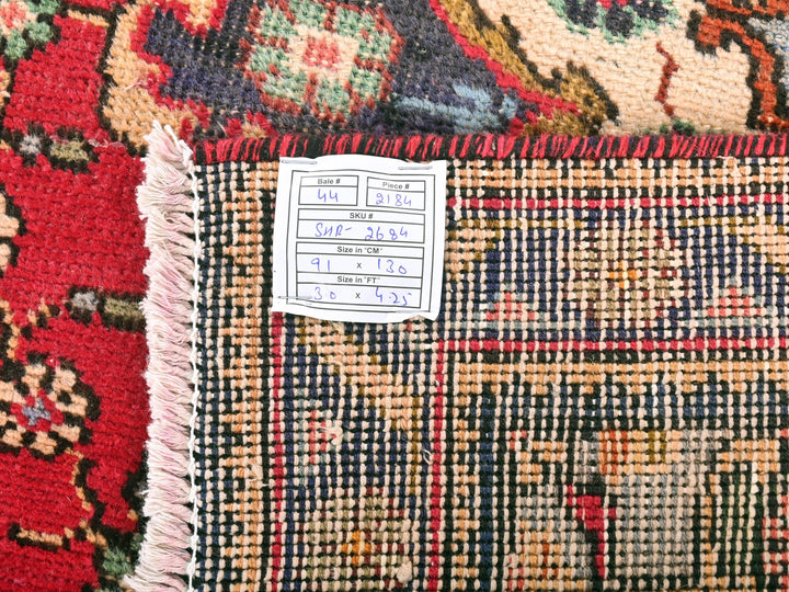 a close up of a rug with a tag on it