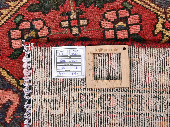 a close up of a rug with a ruler on it