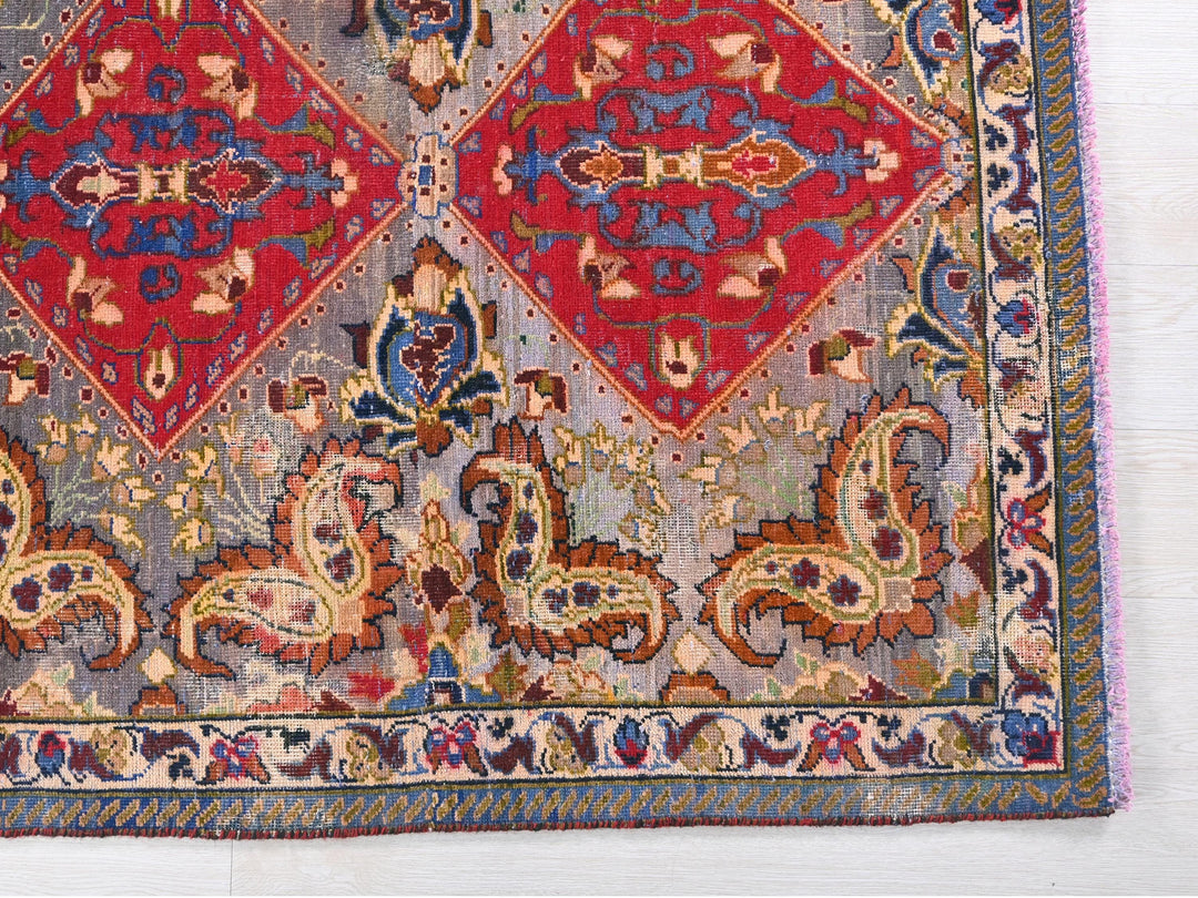 a red and blue rug on a white floor