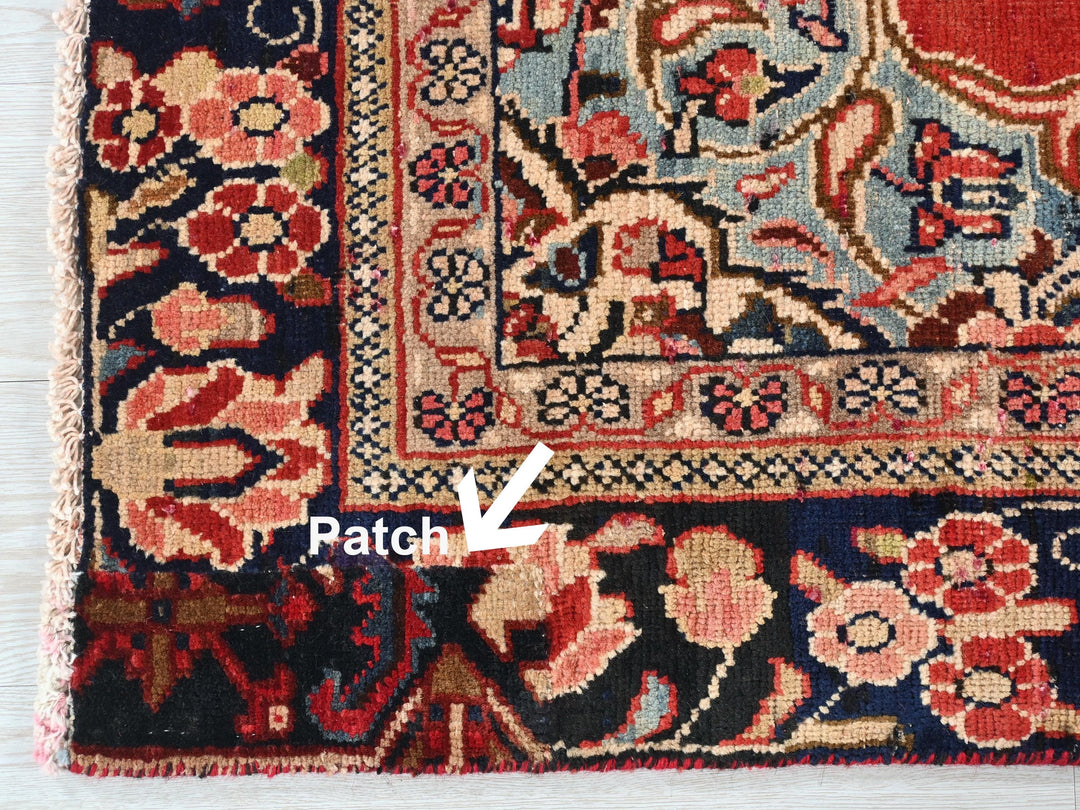 a close up of a rug on a wooden floor