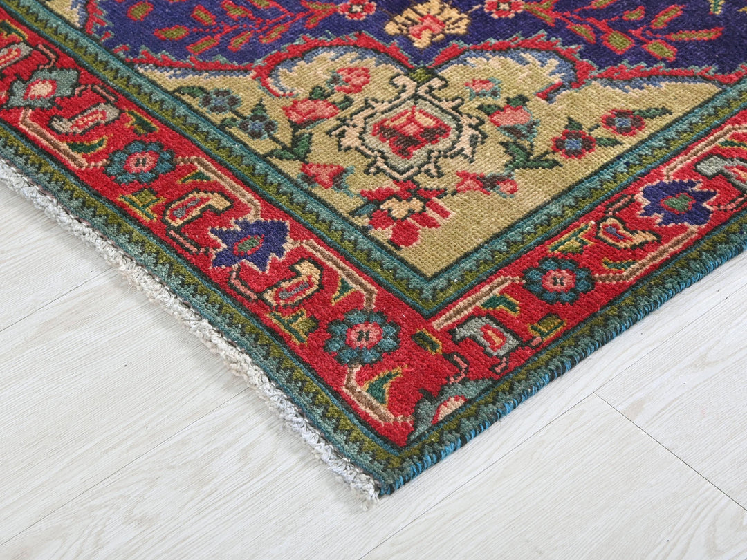 a rug with a red, blue, and green design on it
