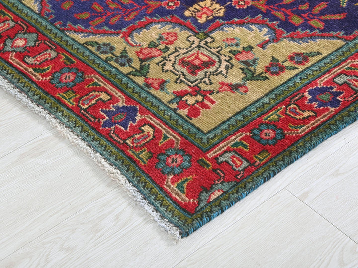 a rug with a red, blue, and green design on it