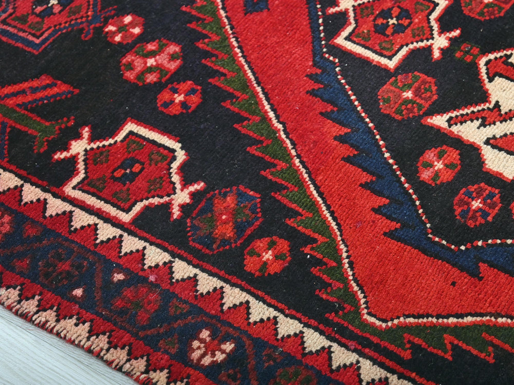 a close up of a rug on a wooden floor