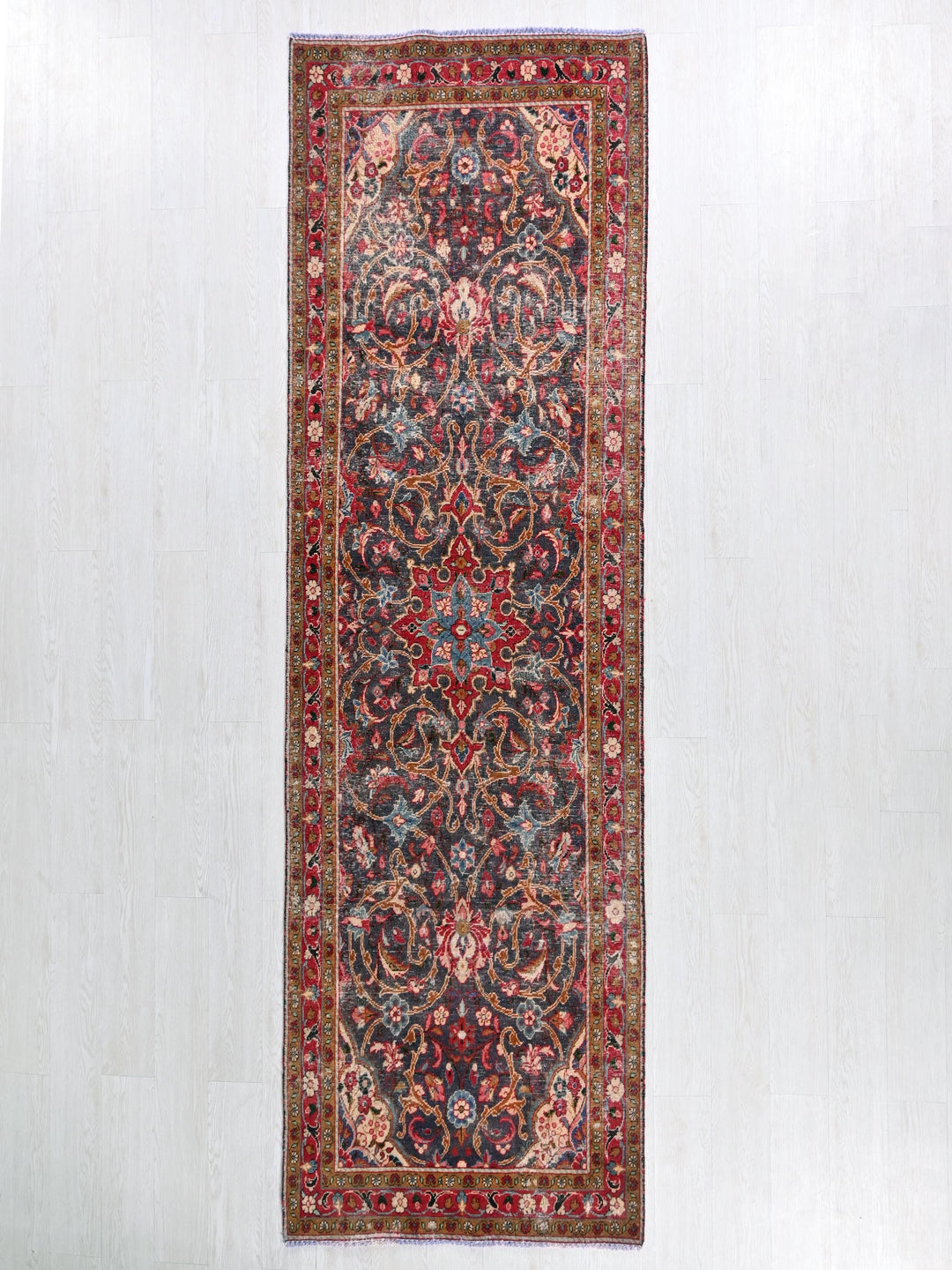 a rug hanging on a wall in a room