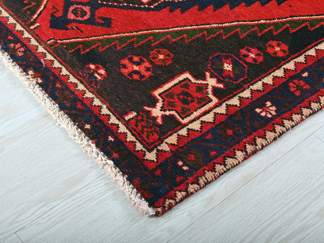 a close up of a rug on a wooden floor