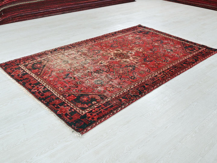 a red rug on the floor of a room