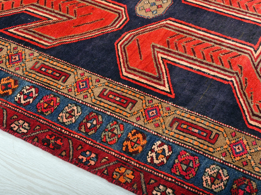 a colorful oriental rug with a blue background