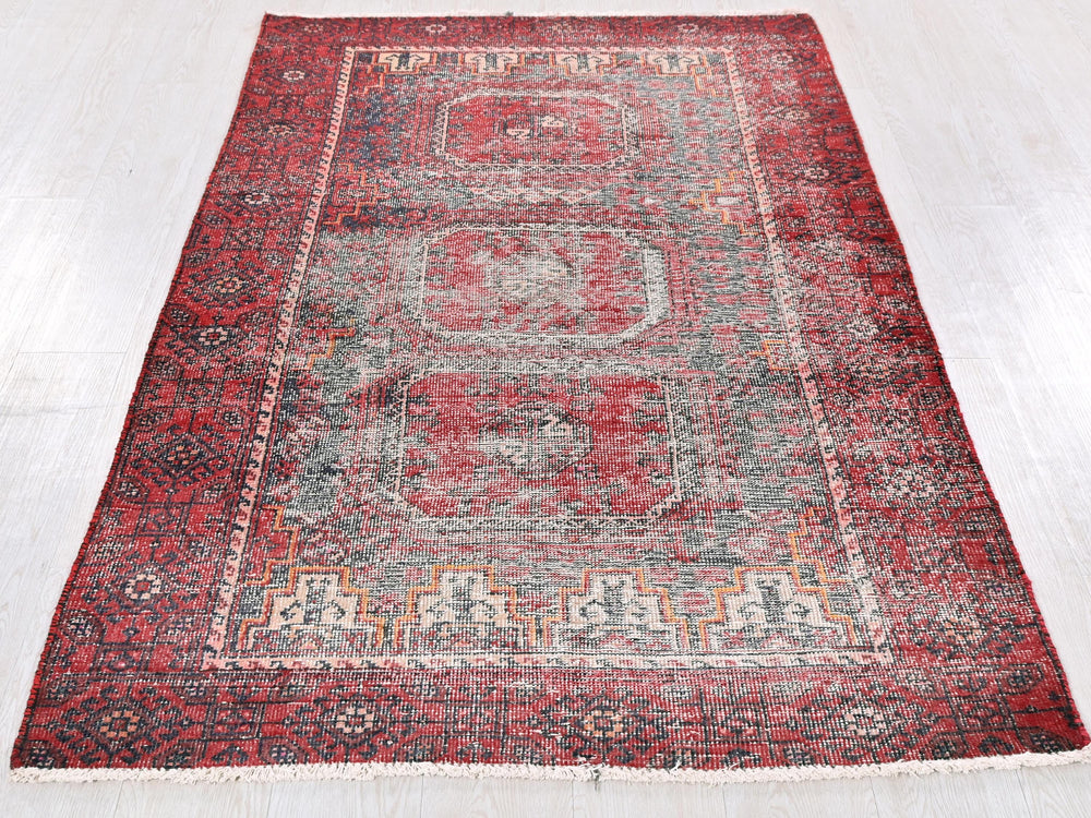 a red rug on a white floor in a room