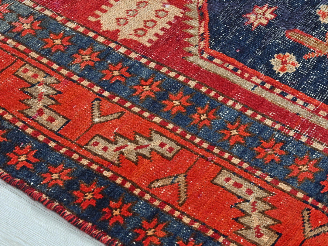 a close up of a rug on a wooden floor
