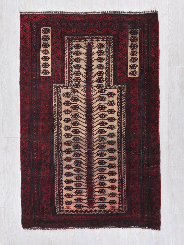 a red and white rug with a design on it