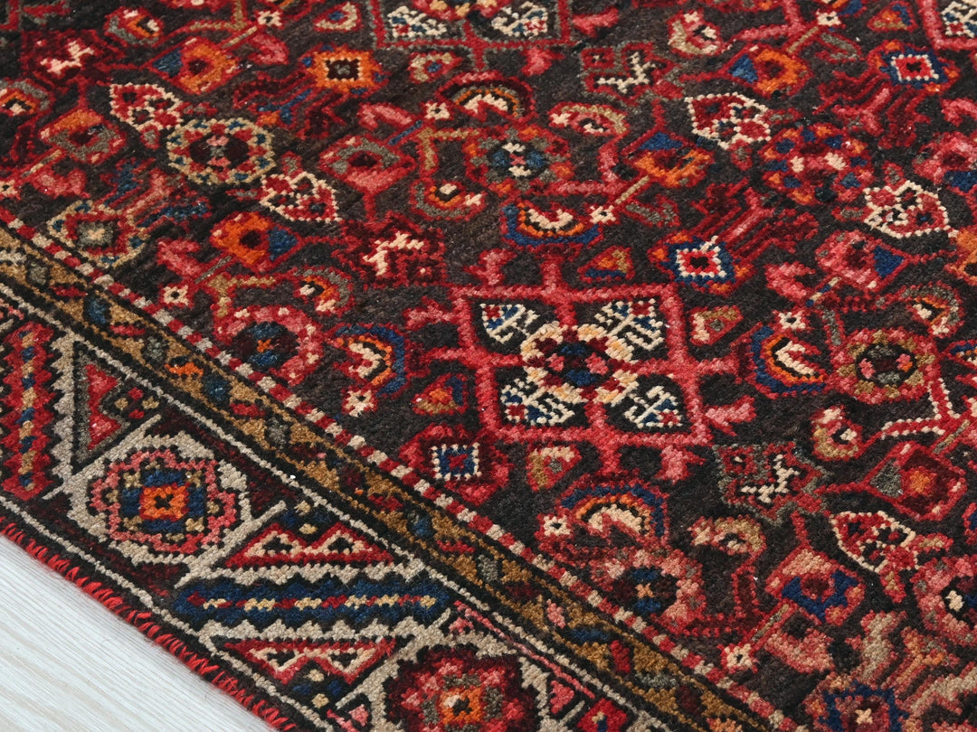 a close up of a rug on a wooden floor