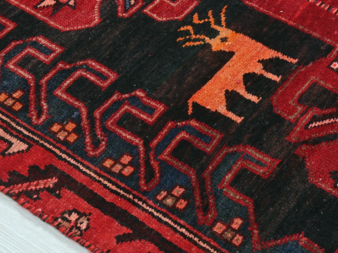a close up of a rug with a deer on it