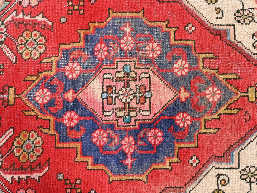 a close up of a red oriental rug