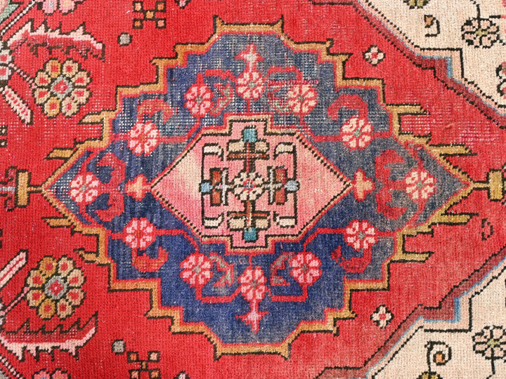 a close up of a red oriental rug