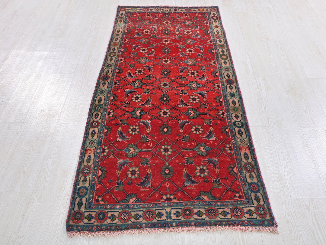 a red rug on a white floor in a room
