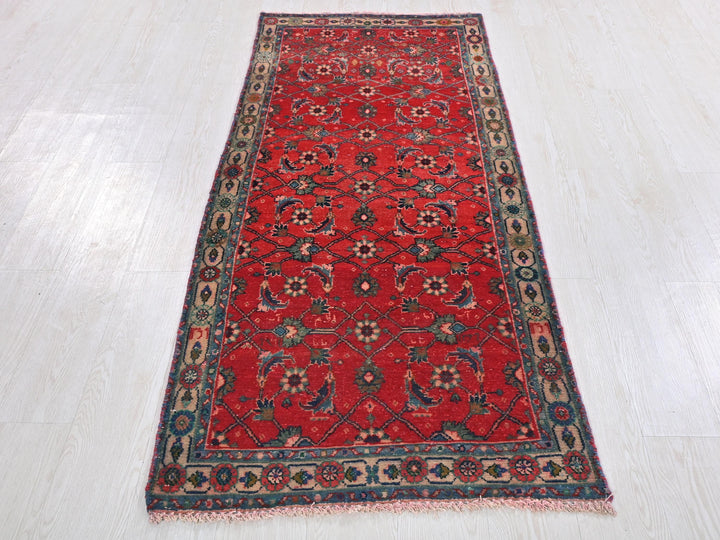 a red rug on a white floor in a room