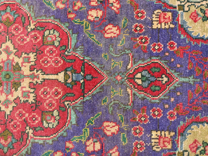 a close up of an oriental rug with many colors