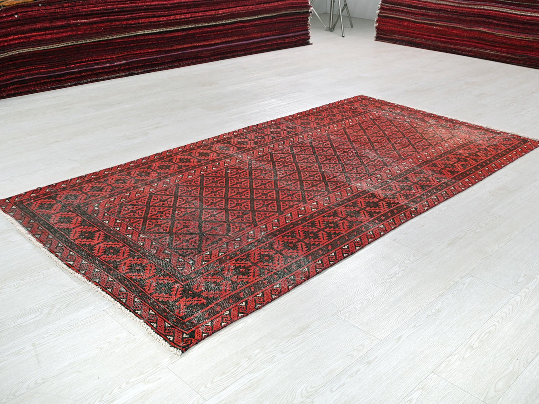 a red rug on a white floor in a room