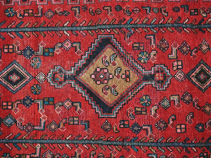 a close up of a red oriental rug