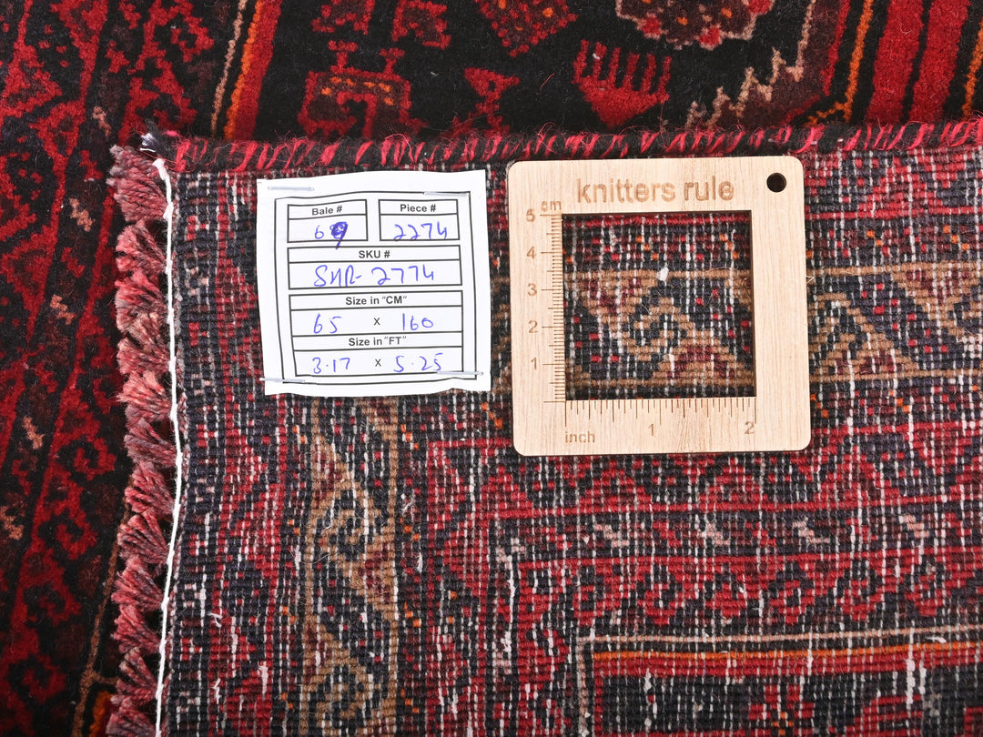 a piece of cloth with a ruler on top of it