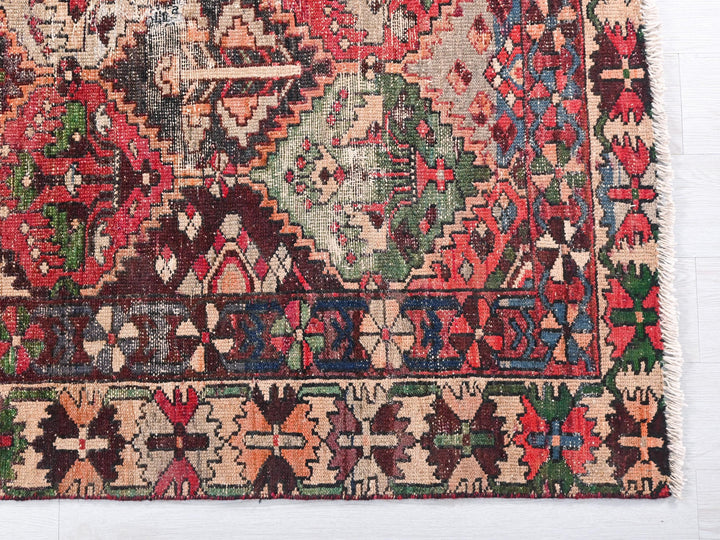 a multicolored oriental rug on a white background