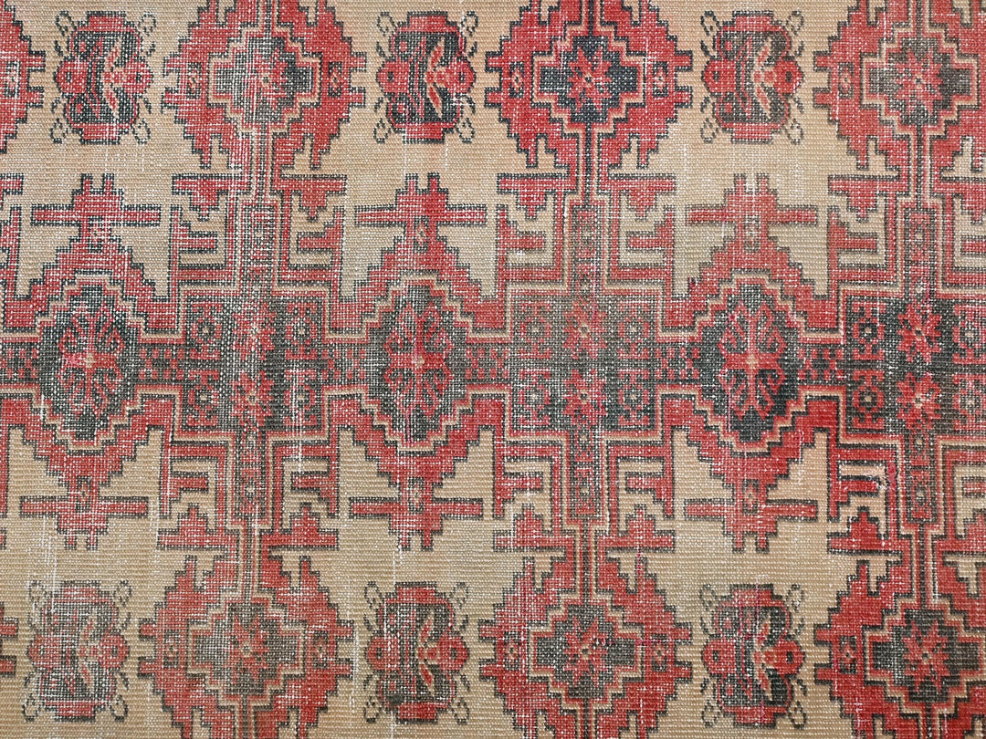a red and black rug with a pattern on it