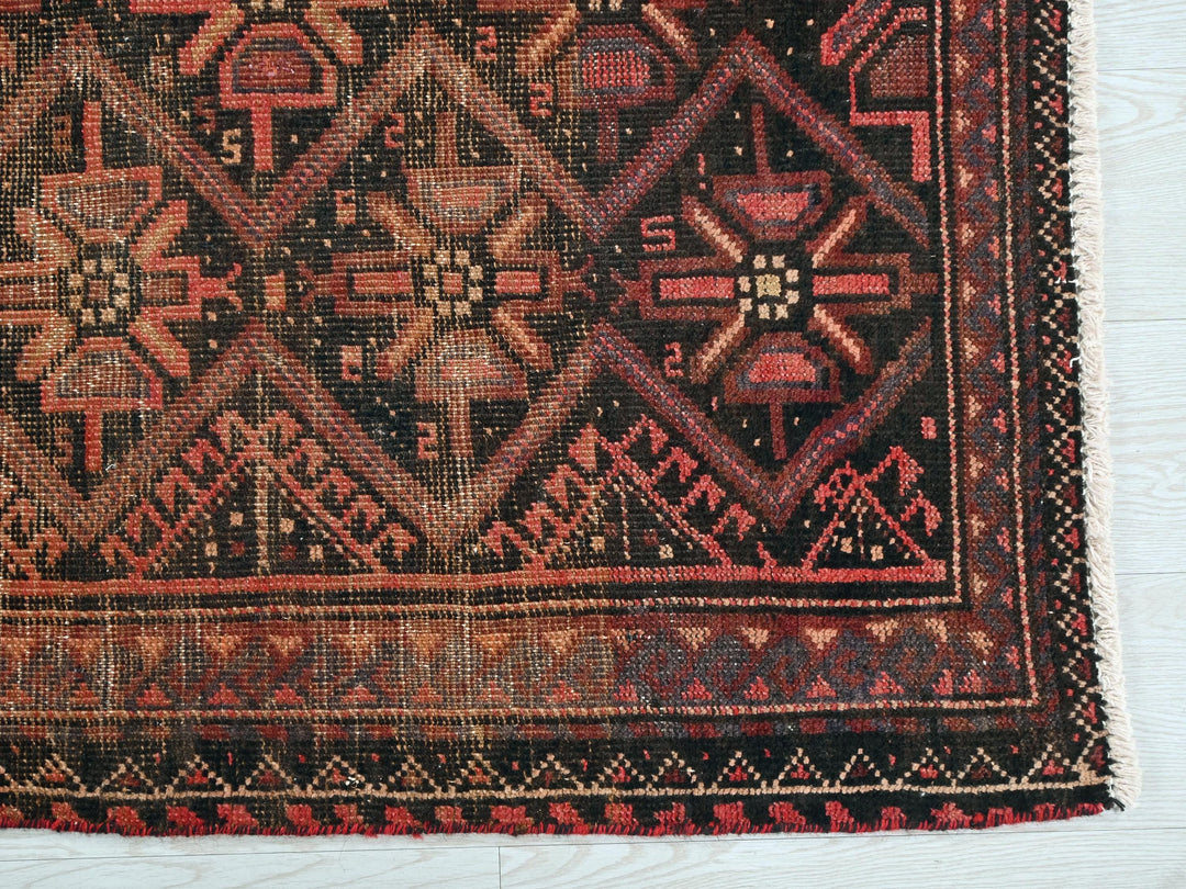 a close up of a rug on a white surface