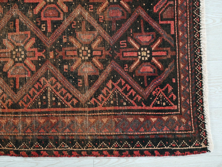 a close up of a rug on a white surface