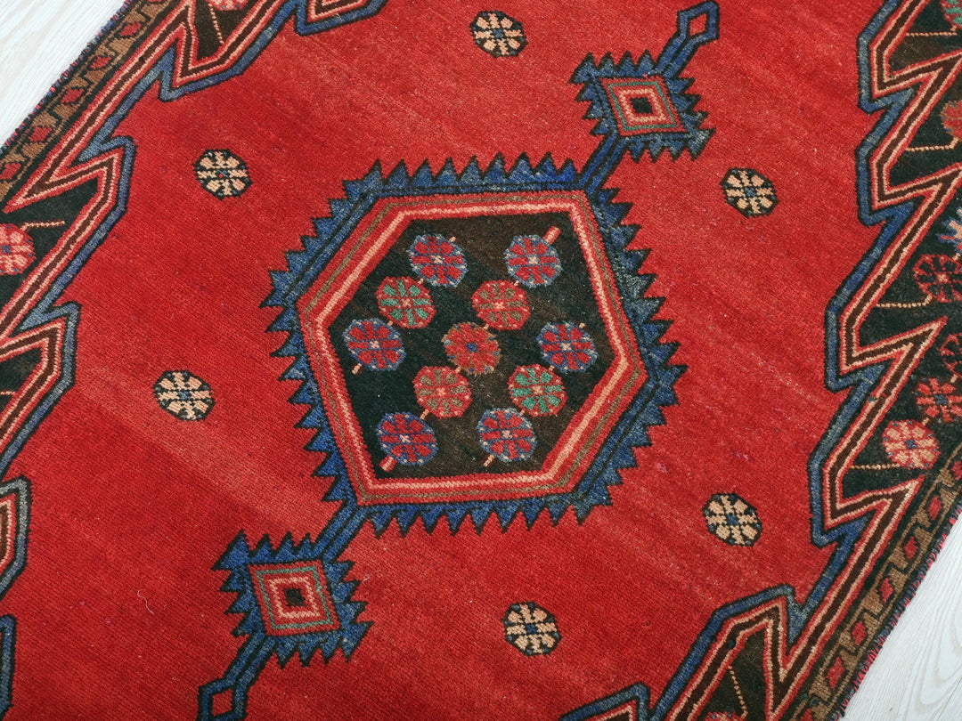a close up of a rug on a wooden floor
