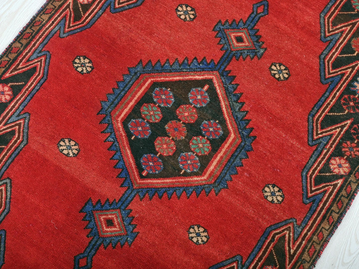 a close up of a rug on a wooden floor