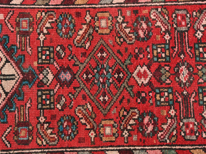 a close up of a red oriental rug