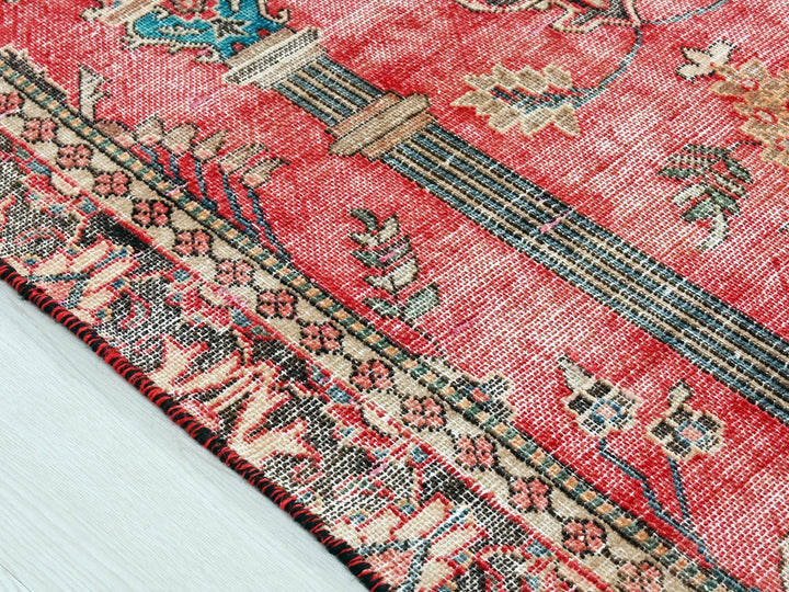 a close up of a rug on a wooden floor