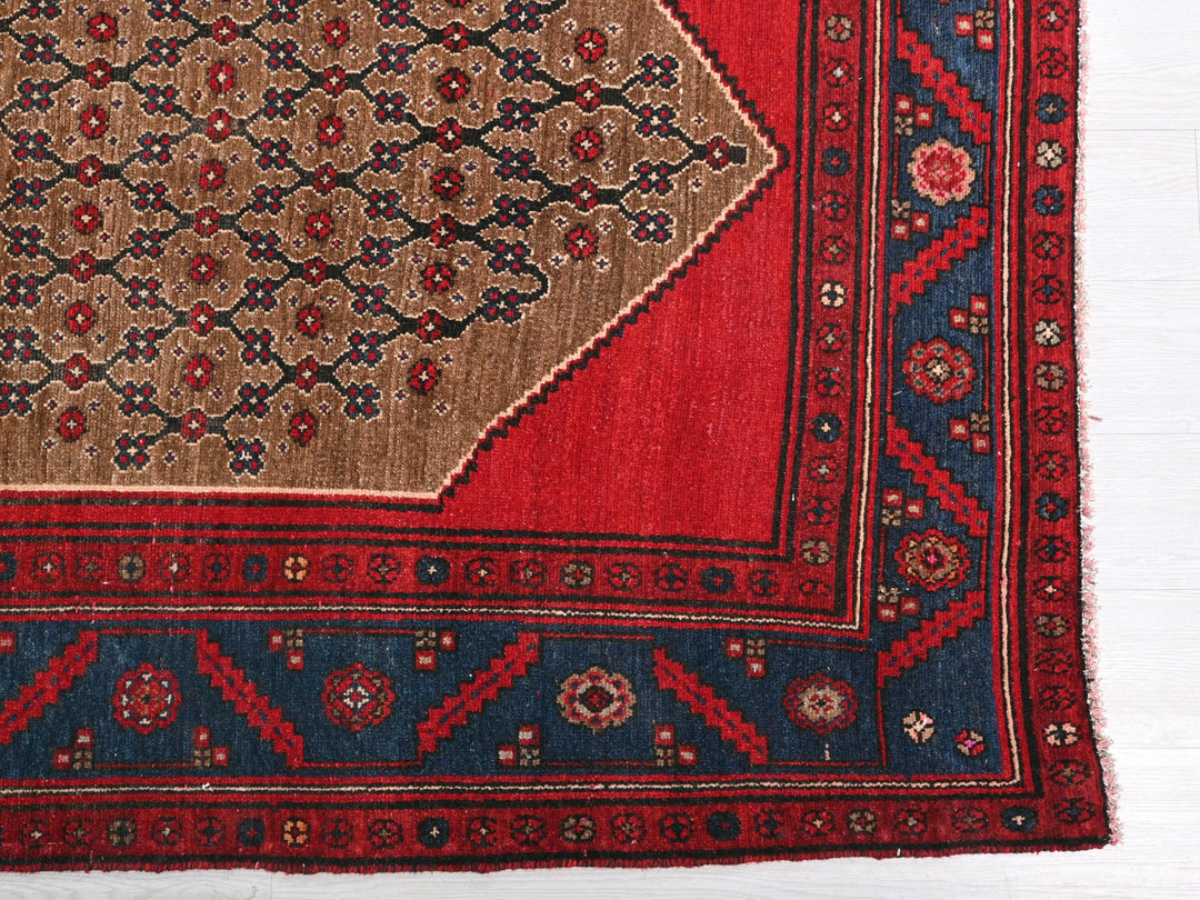 a red and blue rug on a white floor