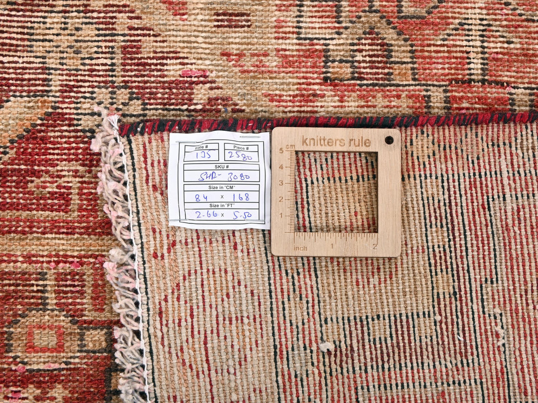 a piece of wood sitting on top of a rug