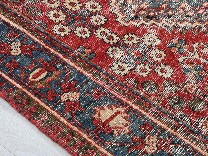 a close up of a rug on a wooden floor