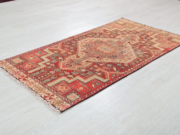 a red rug on the floor of a room