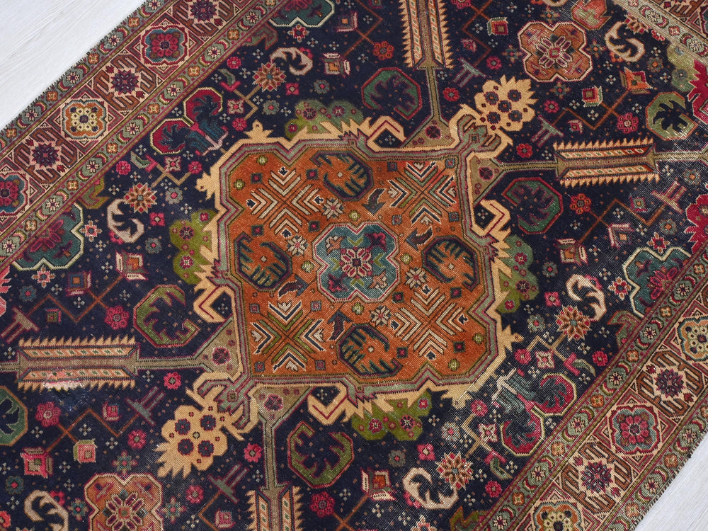 an oriental rug is laying on the floor