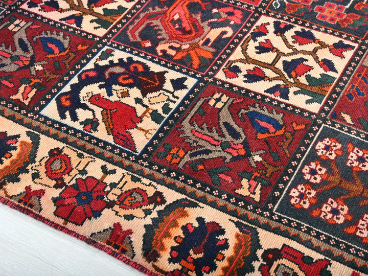 a red and blue rug on a white floor