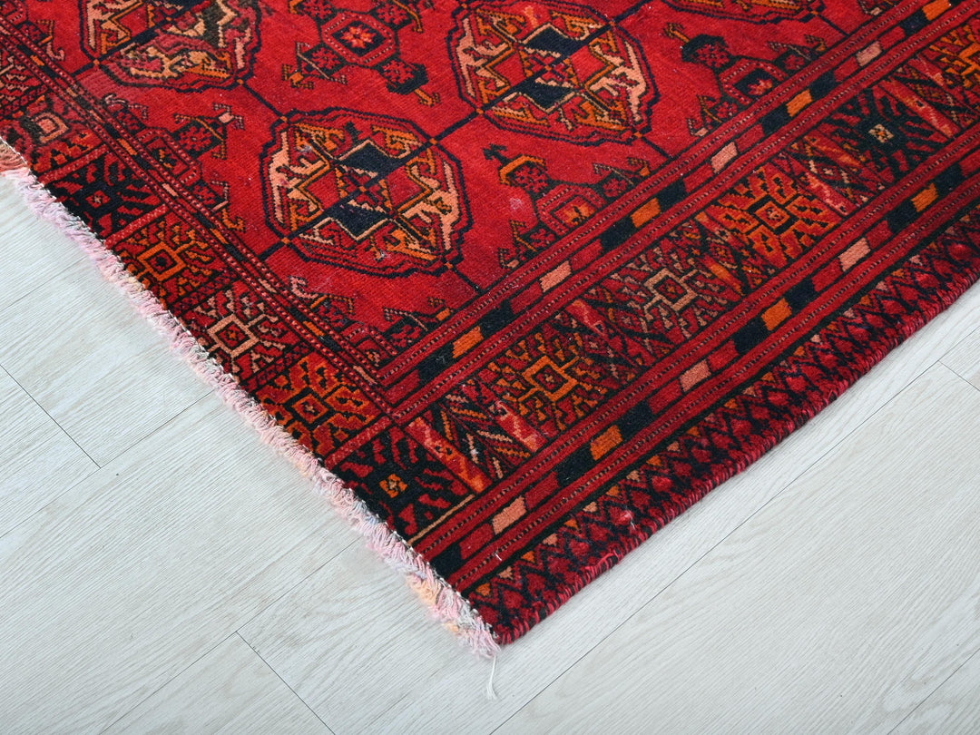 a red rug on the floor of a room