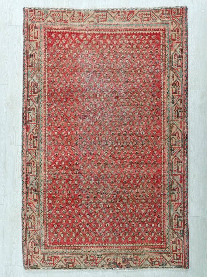 a red rug on a white floor