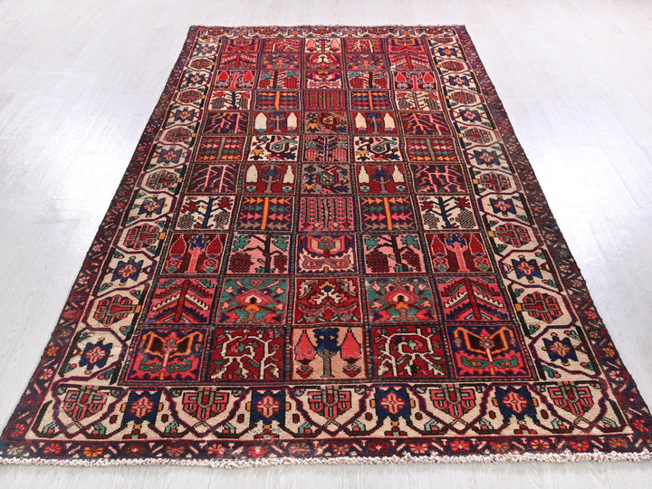a red rug with many different designs on it