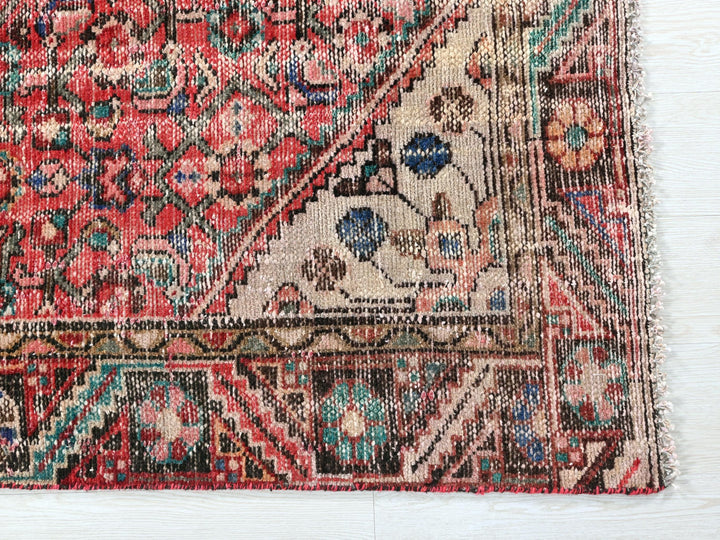 a rug with a red and blue design on it