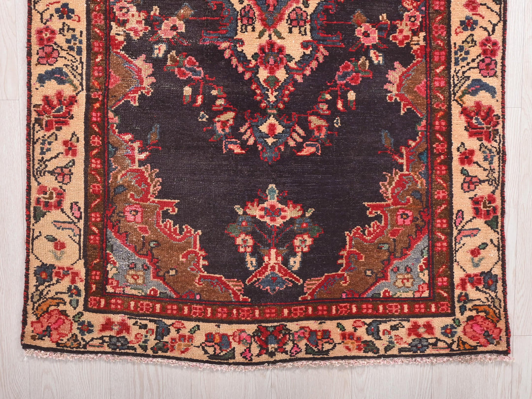 a rug with a design of flowers and leaves