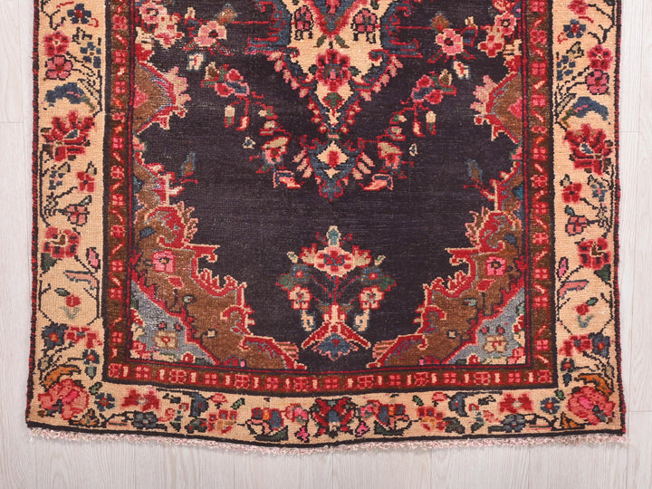 a rug with a design of flowers and leaves